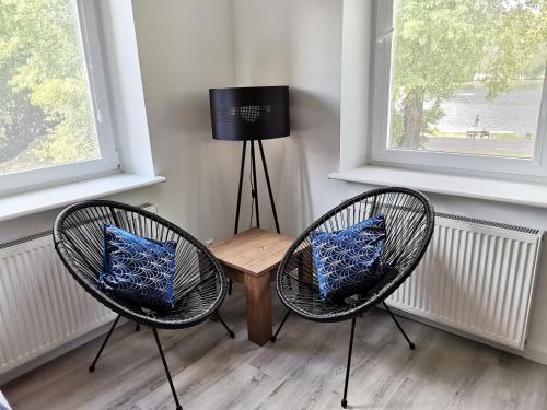 Televízia a/alebo spoločenská miestnosť v ubytovaní Kamienica nad Maltą- Mieszkania nad Jeziorem Maltańskim
