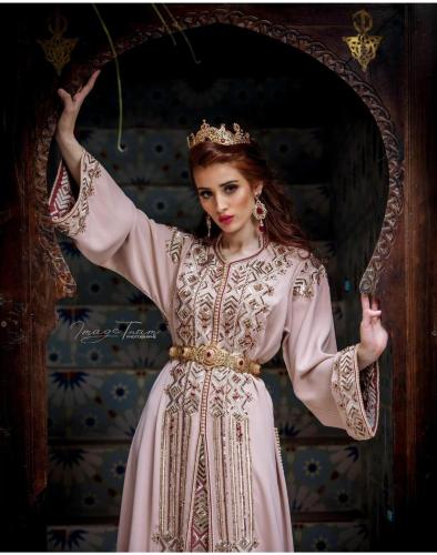 a woman in a pink dress with a tiara at RIAD ESMERALDA By Dar Ouezzani in Rabat