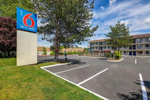 a sign in a parking lot at a hotel at Motel 6-Kirkland, WA - North Kirkland in Kirkland