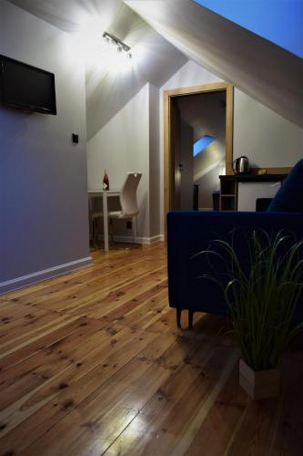 Televisyen dan/atau pusat hiburan di Rewianka Apartamenty przy samej plaży