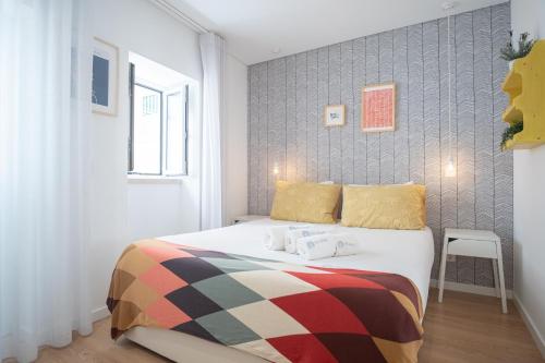 Кровать или кровати в номере Feel Nazaré - Boutique Apartments
