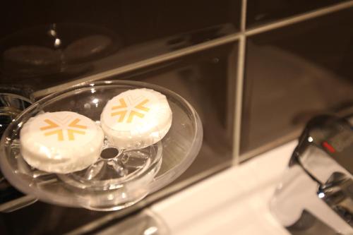 two cakes in a glass bowl in a microwave at KSTAR METRO Hotel in Seoul
