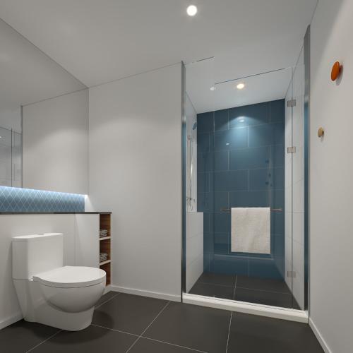 a bathroom with a toilet and a glass shower at Holiday Inn Express Chongqing Airport Zone by IHG in Chongqing