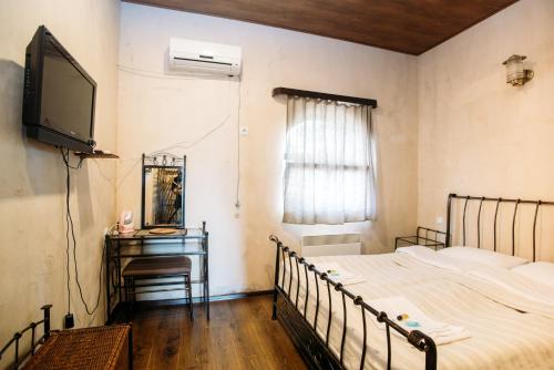 Postel nebo postele na pokoji v ubytování Chateau Eniseli