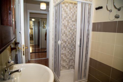 a bathroom with a shower and a sink and a shower at Calabrese Family in Pompei