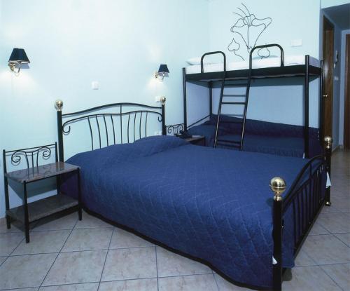 Кровать или кровати в номере Hotel Makednos