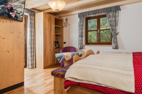 Un pat sau paturi într-o cameră la Millenniumhotel