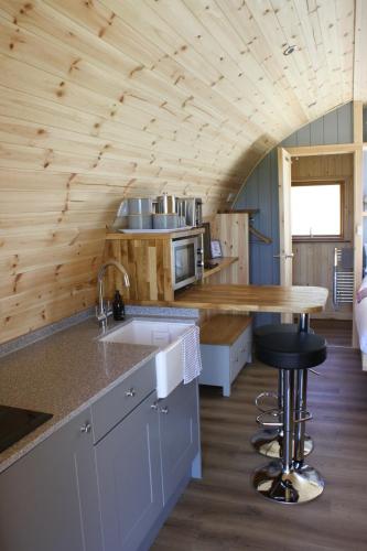 a kitchen with a sink and a counter top at Braeview Glamping in Eyemouth