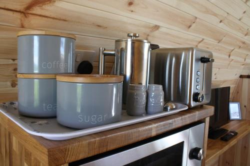 a bunch of pots and pans sitting on a counter at Braeview Escapes in Eyemouth