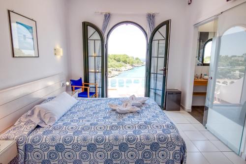Postel nebo postele na pokoji v ubytování Hotel Bahia