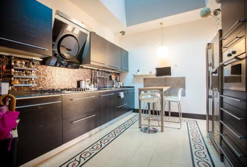 Kuchyň nebo kuchyňský kout v ubytování Splendido Appartamento con terrazzo