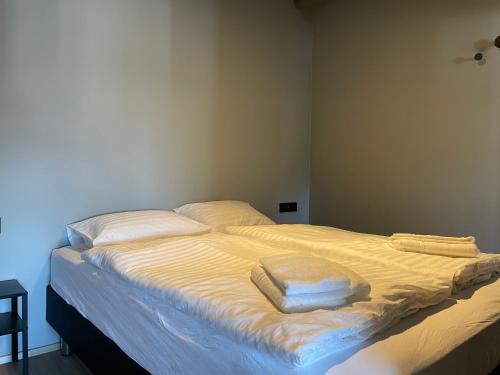 Ένα ή περισσότερα κρεβάτια σε δωμάτιο στο North Apartments Suites