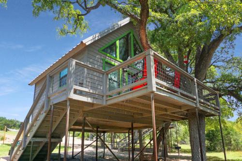 a tree house is being built in a tree at Arbor House of Dripping Springs - Garden House in Dripping Springs