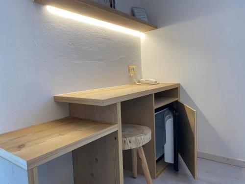 a desk with a chair in a room at Fedaia Joy B&B in Canazei