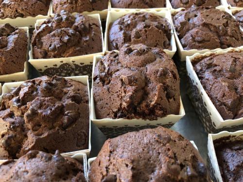 a bunch of chocolate muffins in paper containers at Hotel Villa Serena in Castrocaro Terme