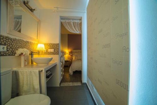 a bathroom with a sink and a toilet in a room at Fonoll Mari in S'Illot
