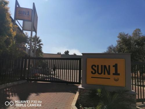a sun sign in front of a gate at SUN1 Vereeniging in Vereeniging