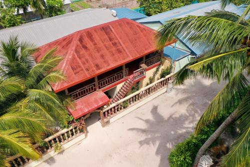 an overhead view of a building with a red roof at Veli Beach Inn in Mathiveri