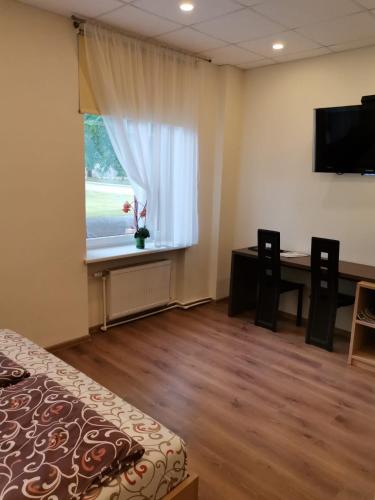 Ένα ή περισσότερα κρεβάτια σε δωμάτιο στο Guest house Baltika