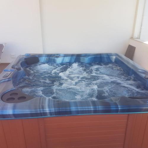a jacuzzi tub with water in a room at Hotel San Francisco in Cala Gonone