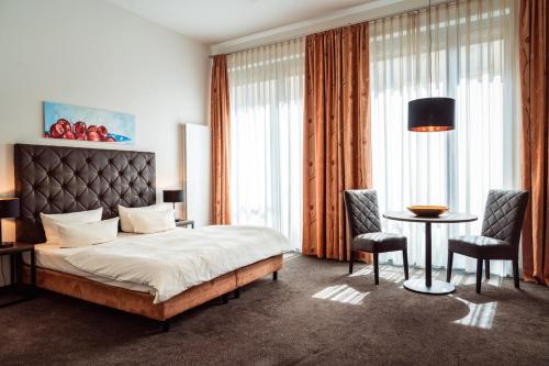 Postel nebo postele na pokoji v ubytování Aparthotel Neumarkt