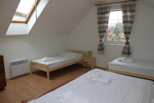 A bed or beds in a room at Dom Via Jasná Demänová