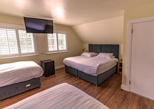 Ένα ή περισσότερα κρεβάτια σε δωμάτιο στο Aisling Guest House