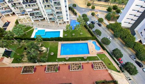 an aerial view of a swimming pool in a city at A826 - Niágara - 2004 Finestrat s.l. in Cala de Finestrat