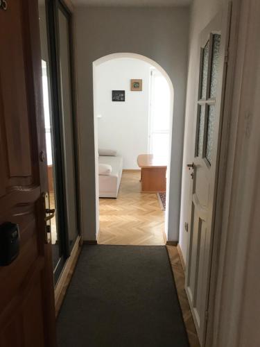 a hallway leading to a bathroom with a toilet at Mieszkanie Dla Turystów in Sandomierz