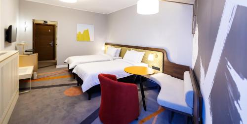 Кровать или кровати в номере Mercure Galati Centrum