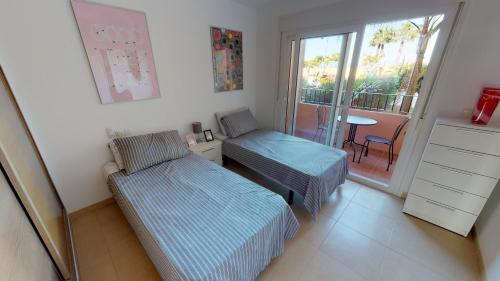 Rúm í herbergi á Casa Kazamour - A Murcia Holiday Rentals Property