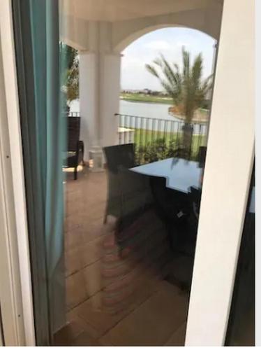 a view from a glass door of a patio with a table at Emperador 302919-A Murcia Holiday Rentals Property in Roldán
