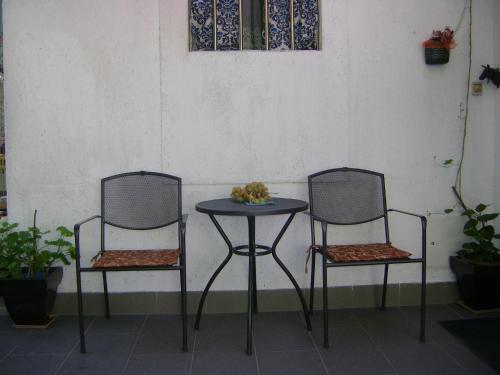 two chairs and a table and a table and chairs at Guest House Marijana in Dubrovnik