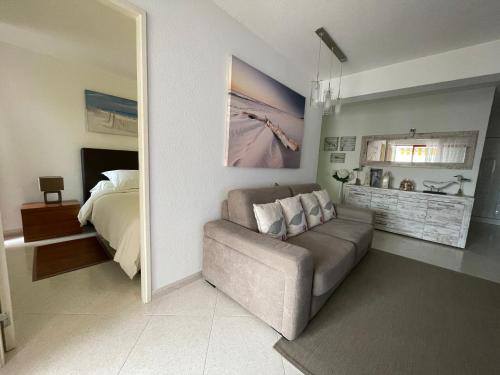 a living room with a couch and a bed at Apartment in Algarve,Vilamoura in Vilamoura