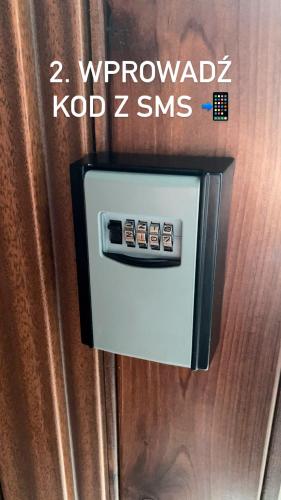 a close up of a refrigerator door with a thermostrophe at LAS SŁUPSKI PREMIUM LOVE APARTAMENT NR5 Wifi Netflix Smart TV50 full kitchen double bathtub up to 4 people full pleasure quality stay in Słupsk