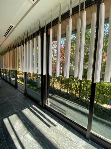 a row of windows in a building at Tassel Hotel Sanjo Shirakawa in Kyoto
