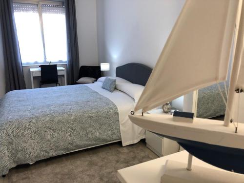 a bedroom with a large bed and a window at Nonna Febronia in Patti