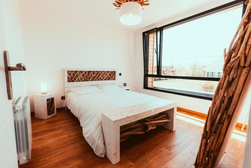 Ein Bett oder Betten in einem Zimmer der Unterkunft Le Paradis du petit Rupembert