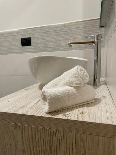 a bath tub in a bathroom with a towel at La Lesivèra Bed and Breakfast in Tione di Trento