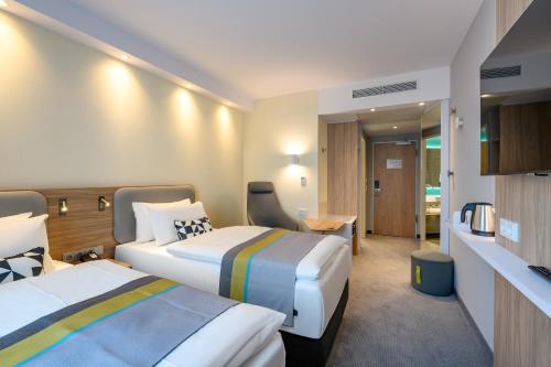 เตียงในห้องที่ Holiday Inn Express - Fulda, an IHG Hotel