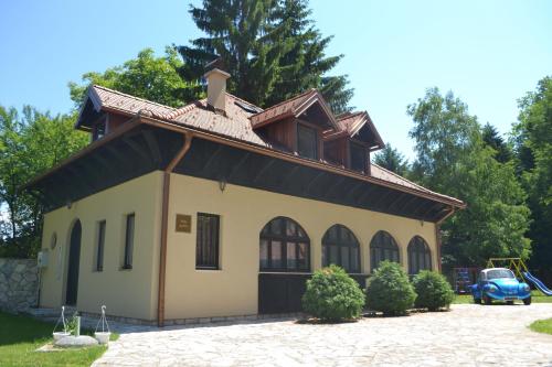 a house with a roof on top of it at Čenga Resort in Sarajevo