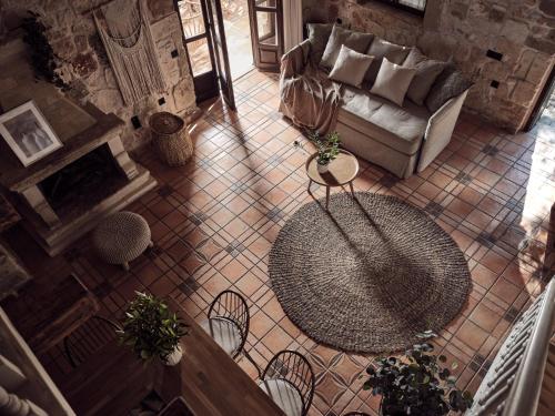 an overhead view of a living room with a couch and a table at Leeda's Village in Lithakia