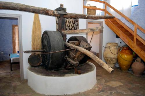 a museum with a wheel on a table in a room at The traditional hause with the best view in Leonidion