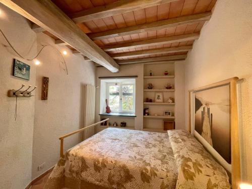 A bed or beds in a room at Il frantoio di Luna - Levanto, 5 Terre