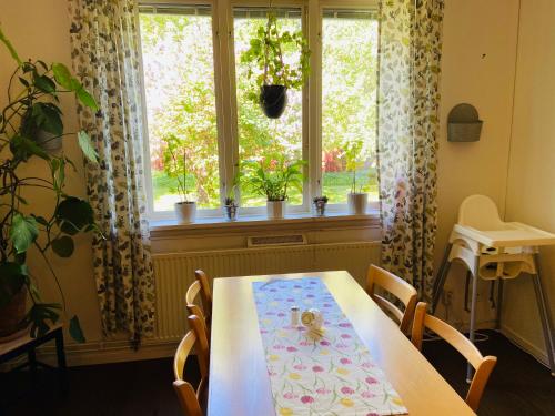 a table with a napkin on it in front of a window at Solakoop B&B in Karlstad