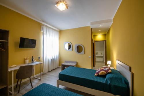A bed or beds in a room at Bacco e Barocco