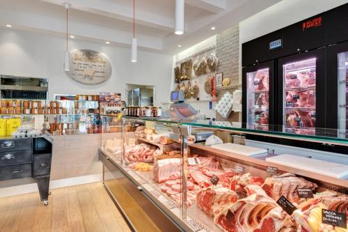a grocery store with a lot of different types of meat at Medieval Charm - Vicopisano Cozy Apartment in Vicopisano
