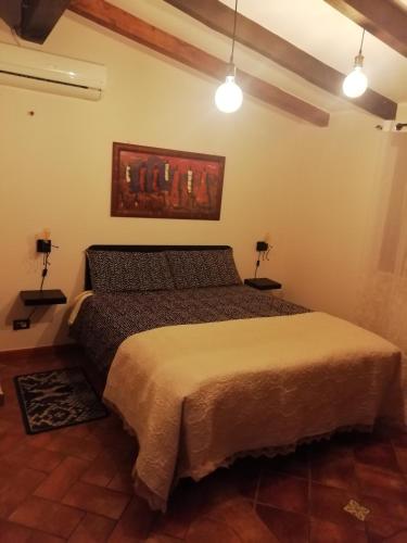 Ένα ή περισσότερα κρεβάτια σε δωμάτιο στο Casa Alessia