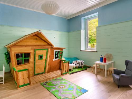 a room with a play room with a play house at Das Schider - Boutique Apart-Hotel in Bad Gastein