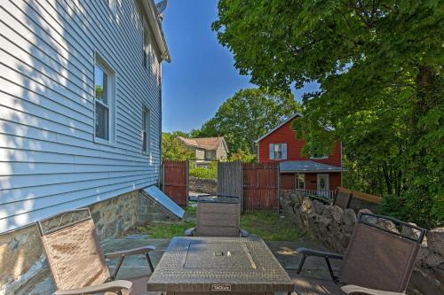 a patio with a table and chairs next to a house at Updated Home with Patio Half Mile to West Point in Highland Falls